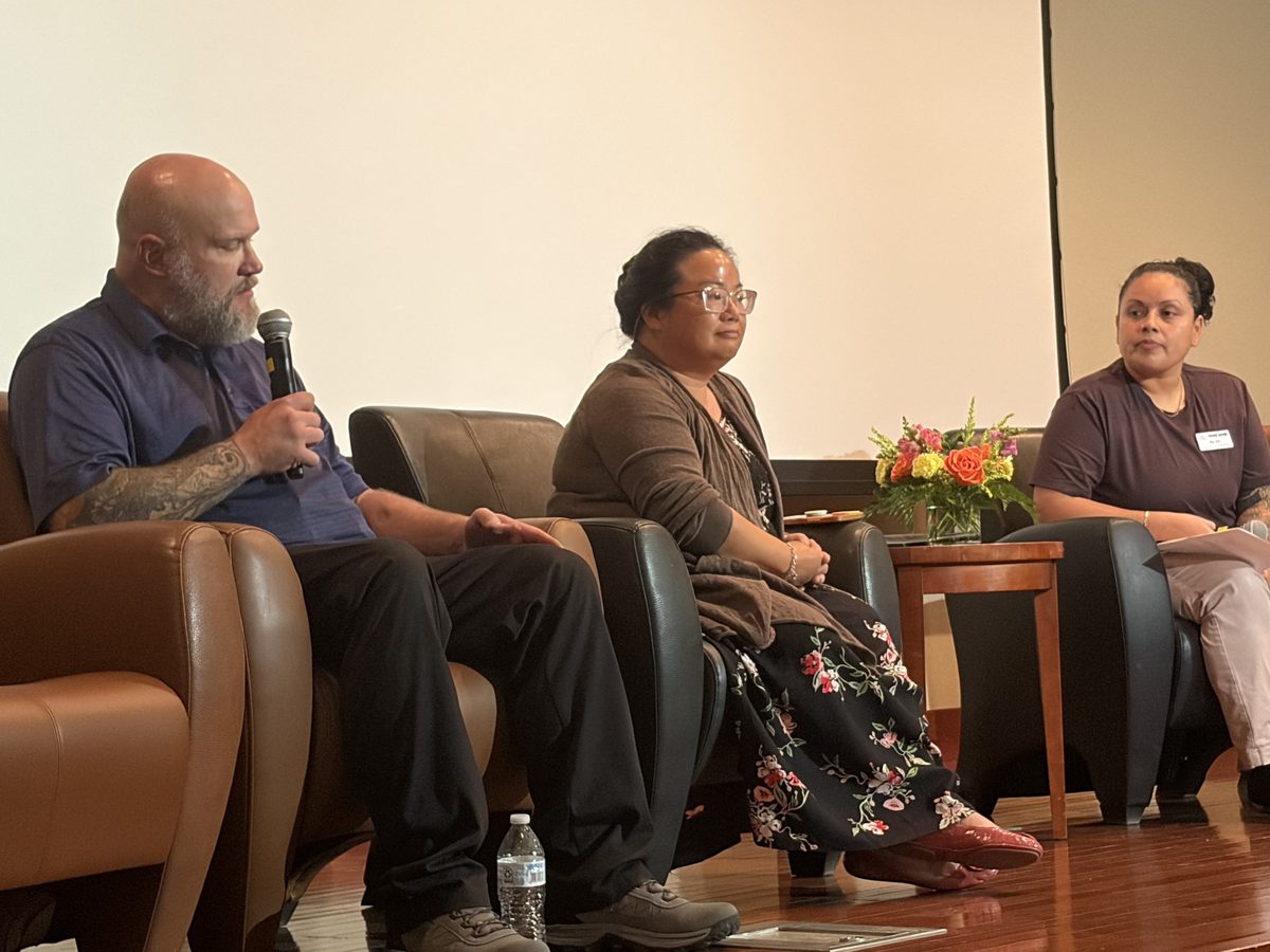 ABLE members speaking on a panel at a community event